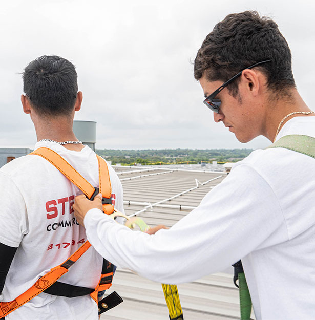 Stephens Commercial painting staff checking harnesses for safety