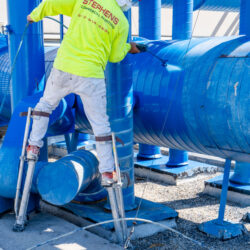 Stephens Commercial Painting - Industrial - Painter coats Industrial Pipe blue