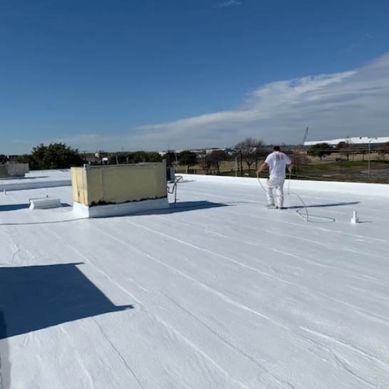 Stephens-Commercial-Painting-Roof-Coatings-Asphalt-Gallery-Image3-Painter-coats-top-of-roof-with-white-coating Asphalt Roofing Coating - Stephens Commercial Painting - Painter coats roof