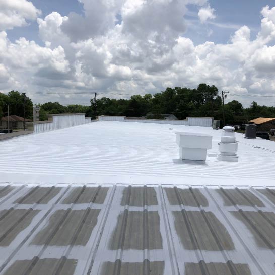 Stephens-Commercial-Painting-Roof-Coatings-Metal-Gallery-Image3-Metal-rooftop-in-the-process-of-being-painted Roof Coatings - Stephens Commercial Painting - Metal rooftop in the process of being painted